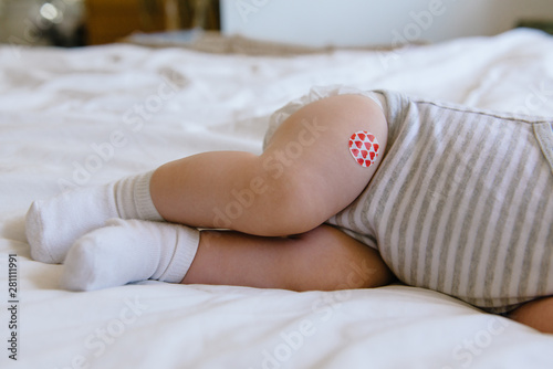 Baby Has Bandage Where She Received a Vaccination