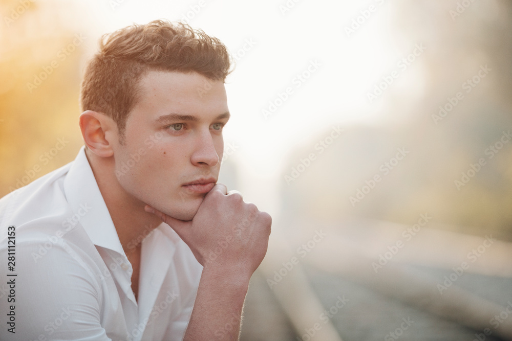 © Mika Knezevic/Stocksy - Close up of thoughtful young man © Mika Knezevic/Stocksy - Close up of thoughtful young man