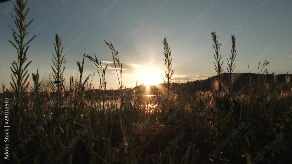 Morning Sunrise Over Calm Lake And Still Grass Morning Sunrise Over Calm Lake And Still Grass