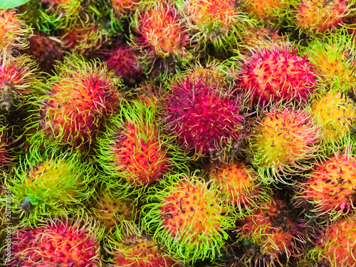 Background. Mature colorful rambutan closeup