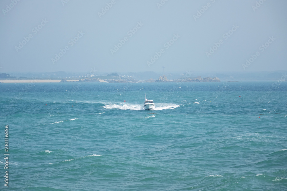 Obraz premium France. Normandie. Speedboat at the Atlantic ocean