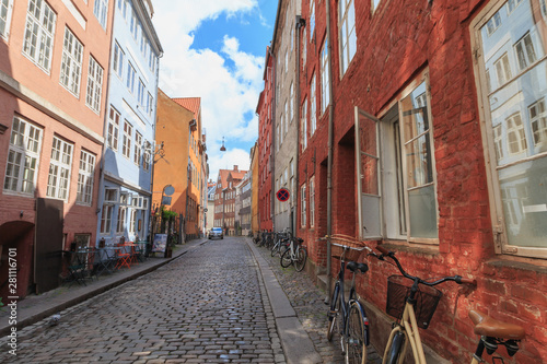 Canvas Print Two locked bicycycles in Copenhagen colorful old town street