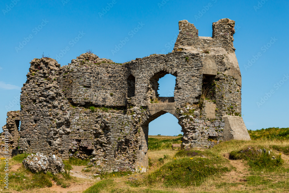 The ruins of Pennard Castle on the cliffs above Three Cliffs Bay on the Gower Peninsula of Wales