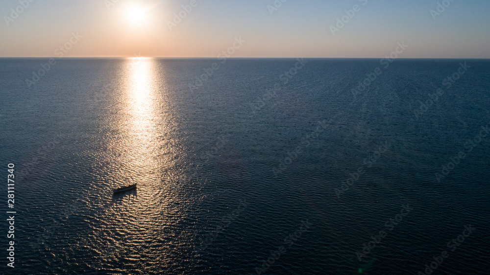 A shipwreck at the black sea shore on a clear morning.