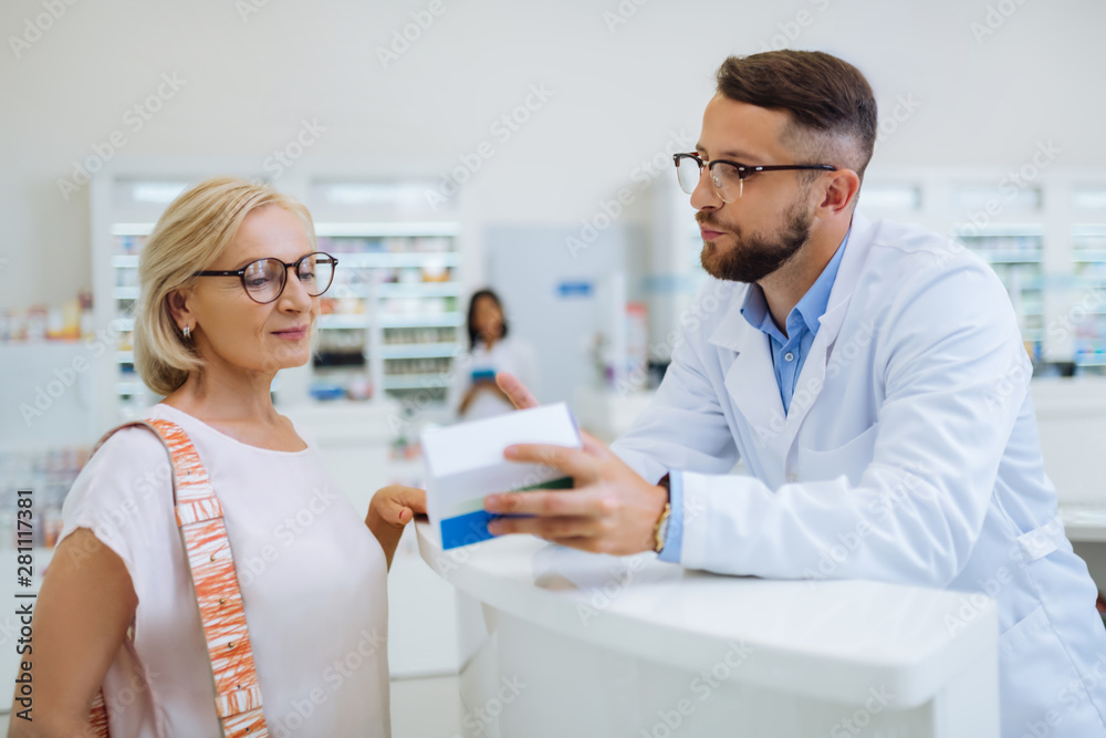 Fototapeta premium Cheerful mature client being in all ears