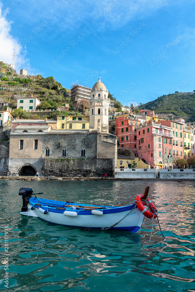  Boat in the harbor of Vernassa. Ligurian coast of Italy. Cinque Terre National Park. Boat on the blue of the sea. Medieval city by the sea.