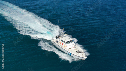 Aerial drone photo of small powerboat cruising in high speed in deep blue Mediterranean sea