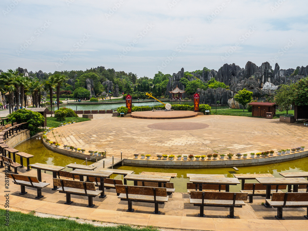 Outdoor theater with rock formations and a lake in the background at Stone Forest in the county 