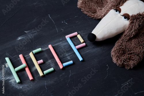 Concept for fear, domestic violence and family or child abuse. Inscription help and toy