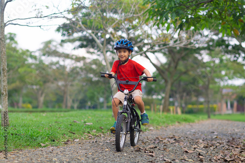 Cheerful Little Boy Riding a Bike