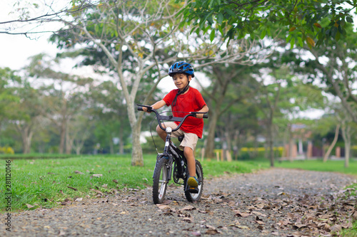 Cheerful Little Boy Riding a Bike