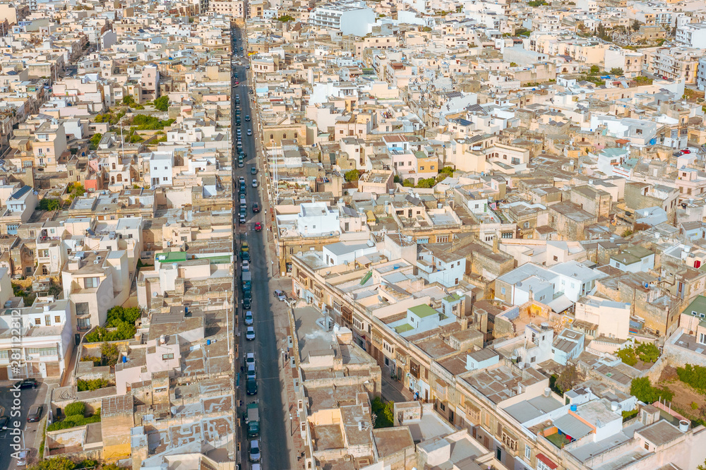 Aerial view of the street and dense low-rise buildings residential buildings in the city, with a dense population. Aerial view of the street and dense low-rise buildings residential buildings in the city, with a dense population.
