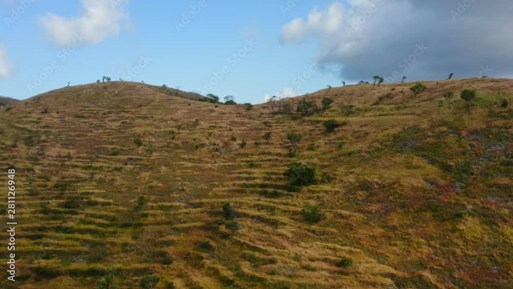 Approaching Dry Grass Hill at Nusa Penida, Bali - Indonesia Approaching Dry Grass Hill at Nusa Penida, Bali - Indonesia