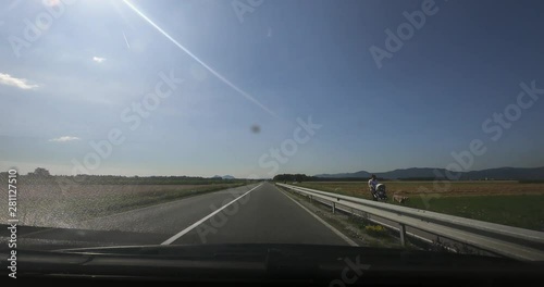 Dashboard hyper / time lapse view of the drive from Kranj to Ljubljana on the old regional road. photo