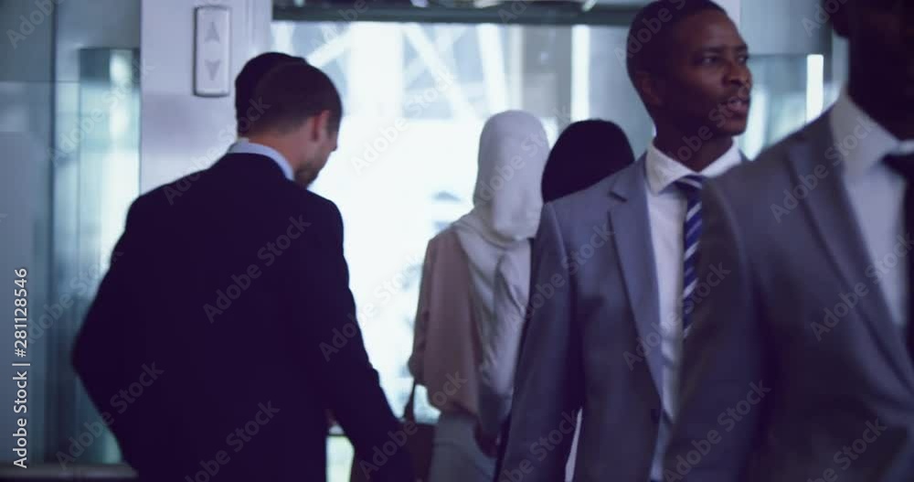 Business people getting out of elevator in a modern office 4k Business people getting out of elevator in a modern office 4k