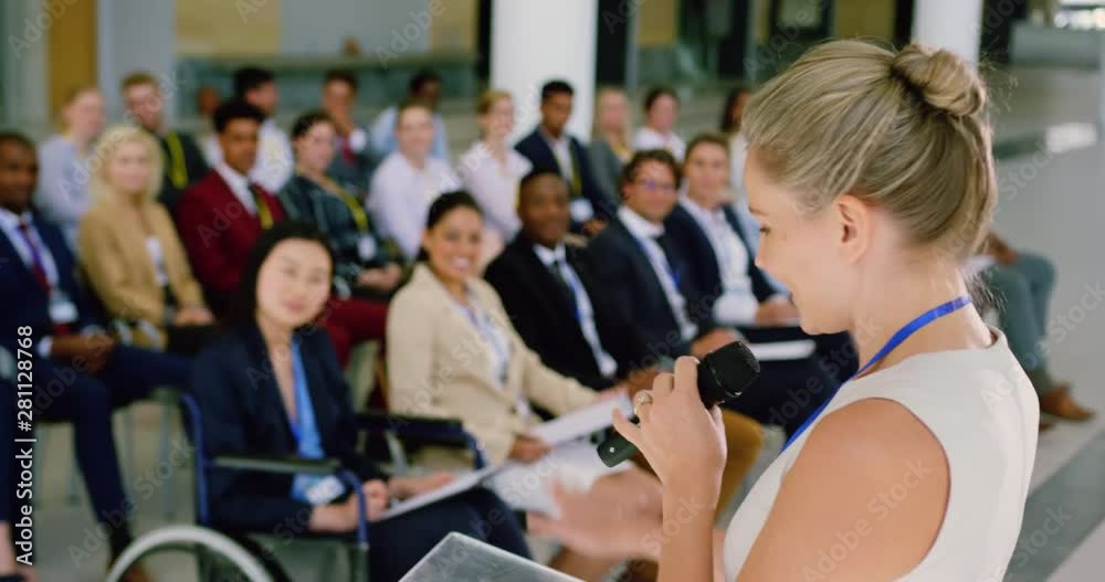 female speaker speaks in a business seminar at modern office 4k