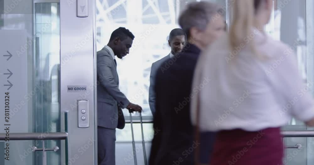 Business people getting in the elevator at modern office 4k Business people getting in the elevator at modern office 4k
