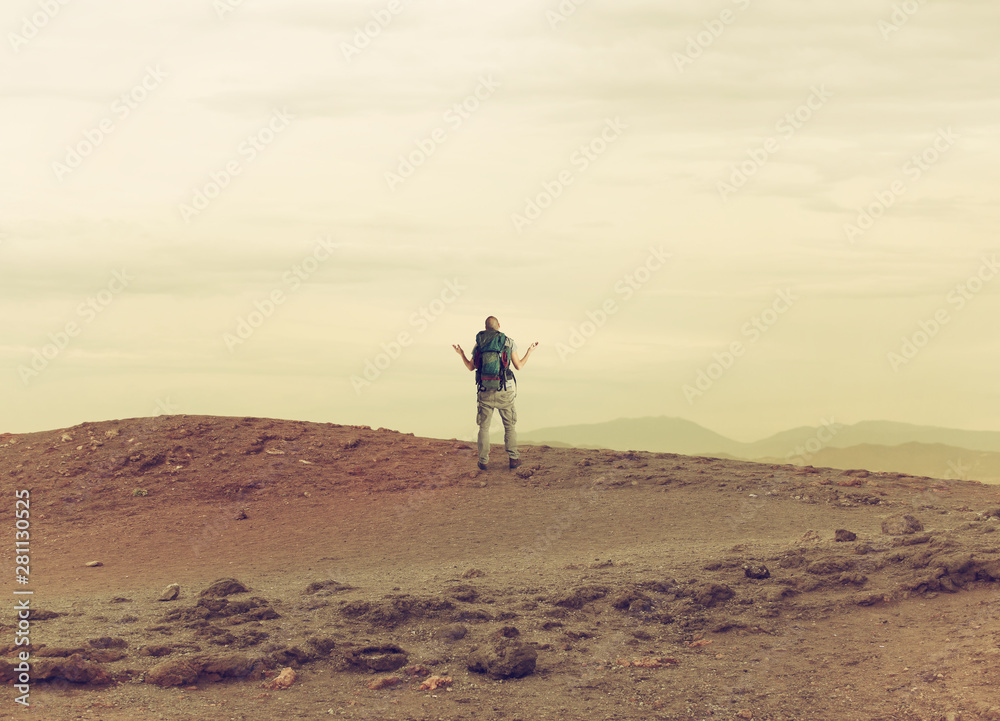 Uncertain explorer is lost in a desert.