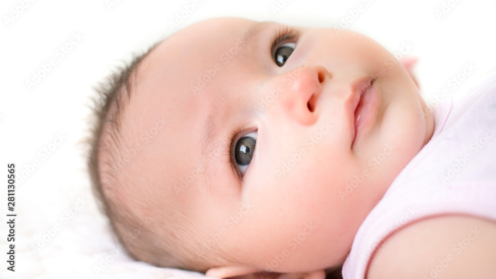close-up baby face eye. nose and mouth with isolated background with white color close-up baby face eye. nose and mouth with isolated background with white color