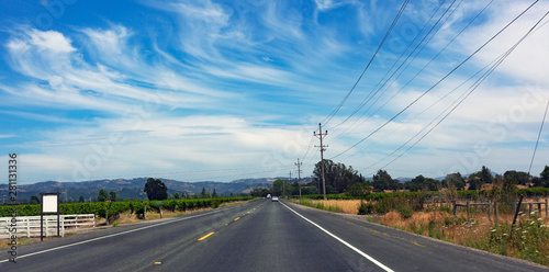Picturesque rural road in Santa Rosa, California wine country under cirrus skies. photo