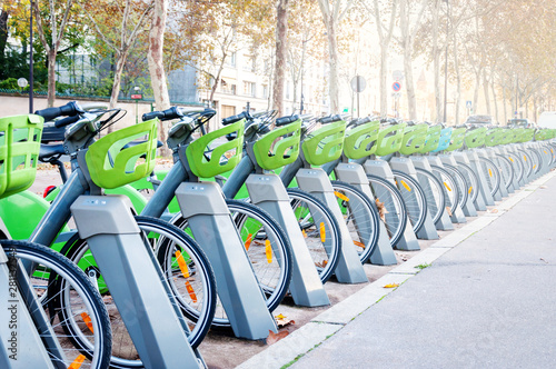 Принти на полотні Parking with a large number of electric bikes for renting and driving around the city