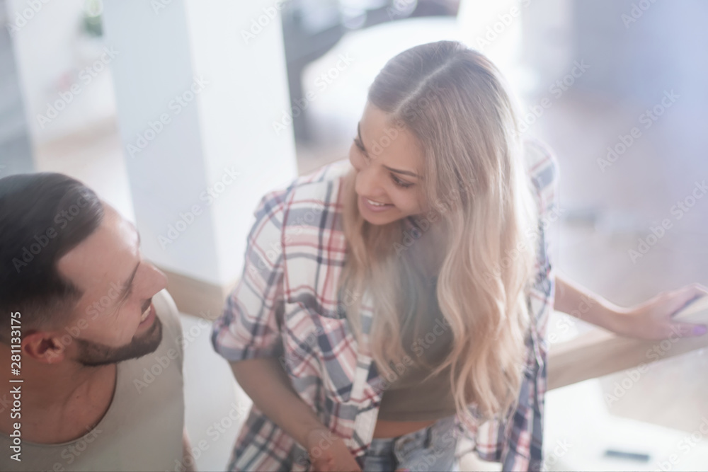 young couple climbed the stairs to their new apartment young couple climbed the stairs to their new apartment