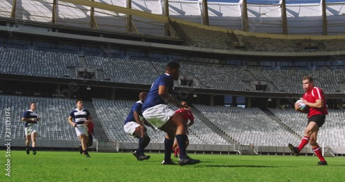 Rugby players playing rugby match in stadium 4k