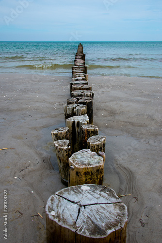 wooden groynes at fischland-darß-zingst peninsula, baltic sea, germany