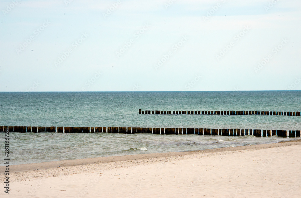wooden groynes at fischland-darß-zingst peninsula, baltic sea, germany
