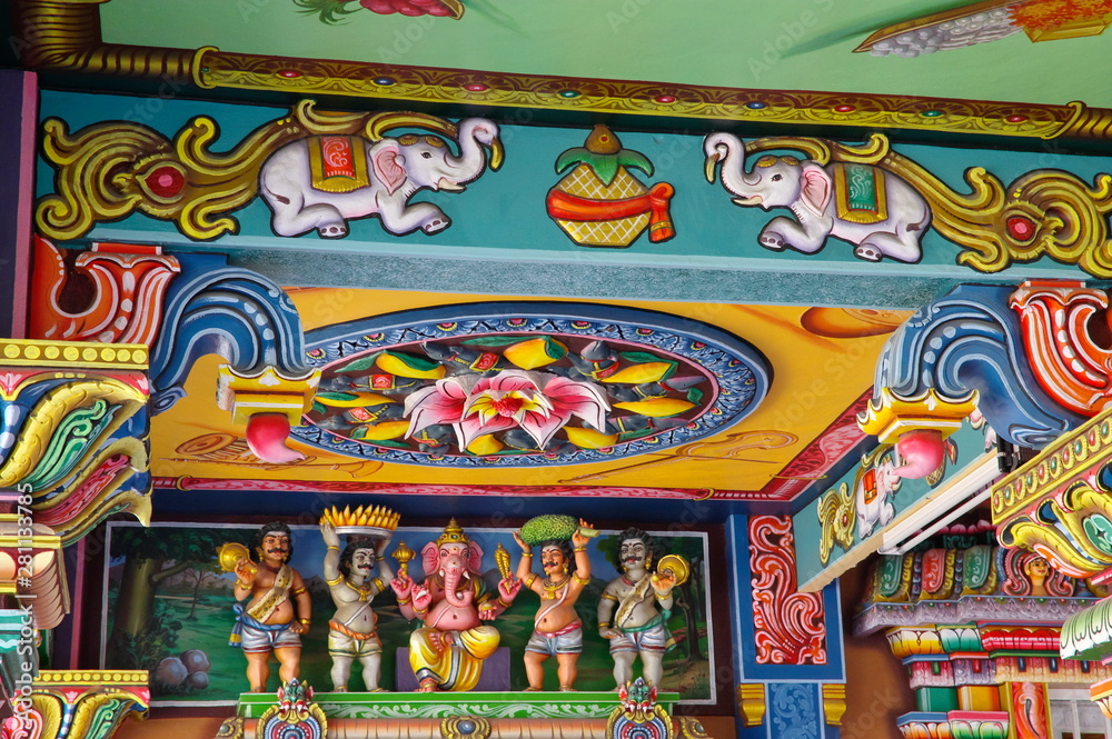 A ceiling of the ancient Hindu Temple with figures of gods and Hindu religion motifs in north of Mauritius island.
