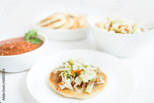 Pupusas from El Salvador with delicious salsa and curtido