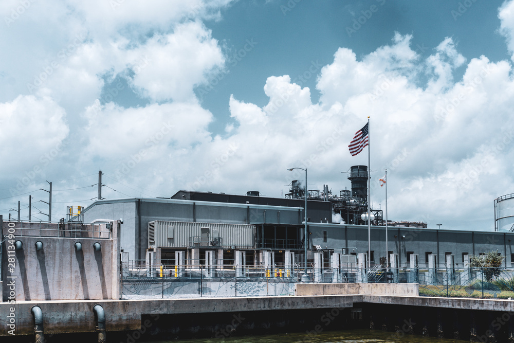 Fototapeta premium Electric central in Florida with the USA Flag