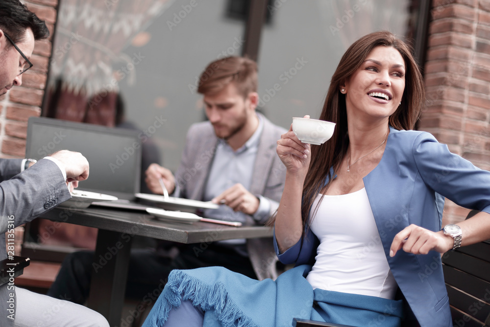 business woman sitting at a table in a cozy cafe business woman sitting at a table in a cozy cafe