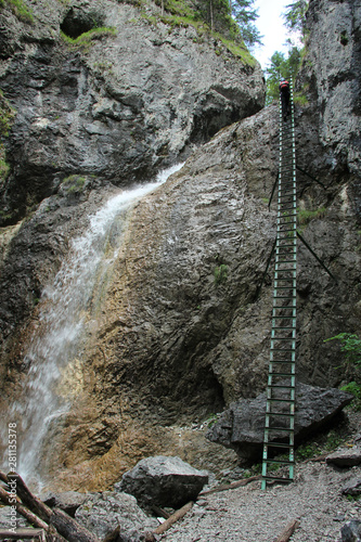 A tourist in the beautiful gorges of the Slovak Paradise National Park photo