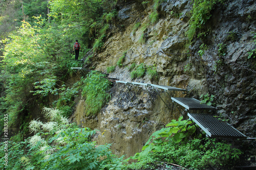 A tourist in the beautiful gorges of the Slovak Paradise National Park photo