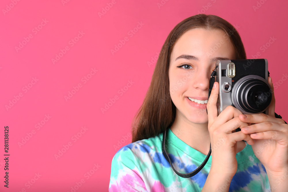 Teenage girl with photo camera on color background Teenage girl with photo camera on color background