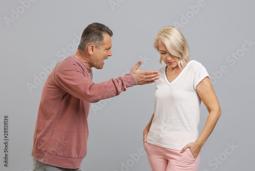 Quarrelling middle-aged cou...