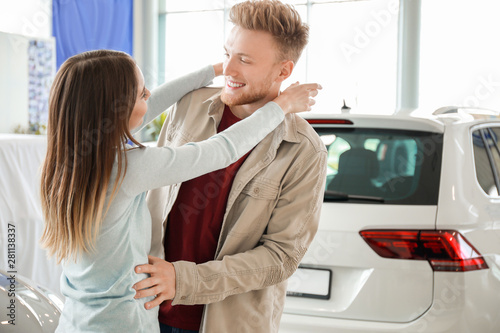 Happy couple buying new car...