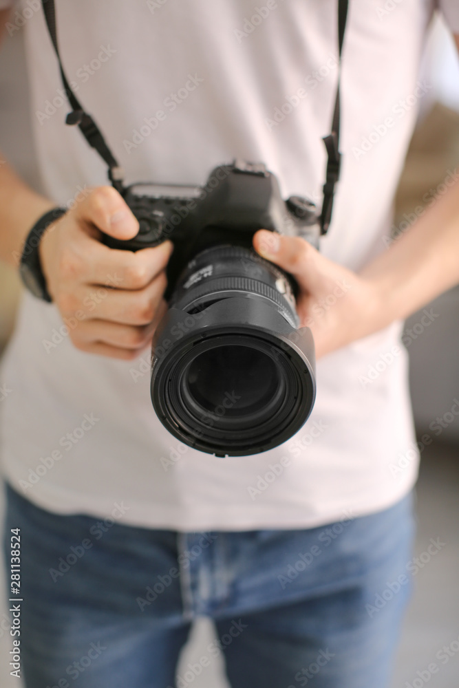 Teenage boy with photo camera at home, closeup Teenage boy with photo camera at home, closeup