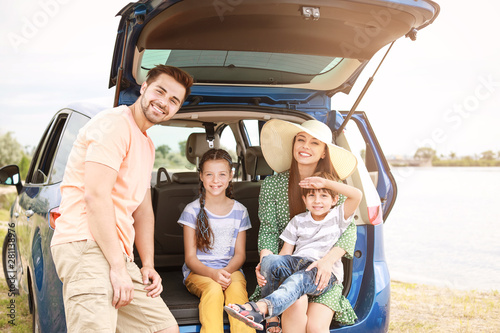 Happy family near car outdoors