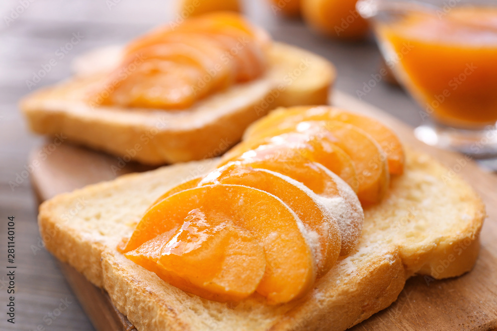Bread slice with tasty apricots, closeup
