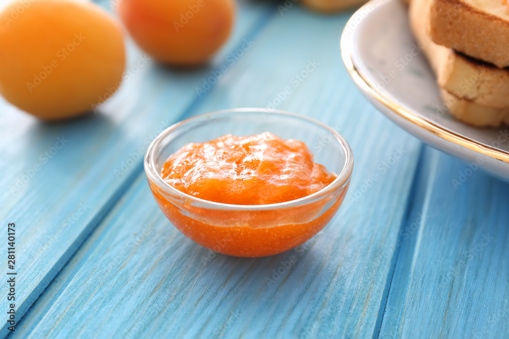 Bowl of tasty apricot jam on table Bowl of tasty apricot jam on table