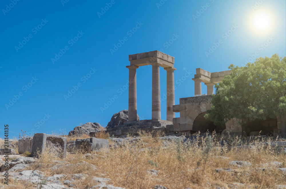 Beautiful scenery in acropolis of Lindos (Rhodes, Greece). Remains of the Ionic pillars in the ancient temple.