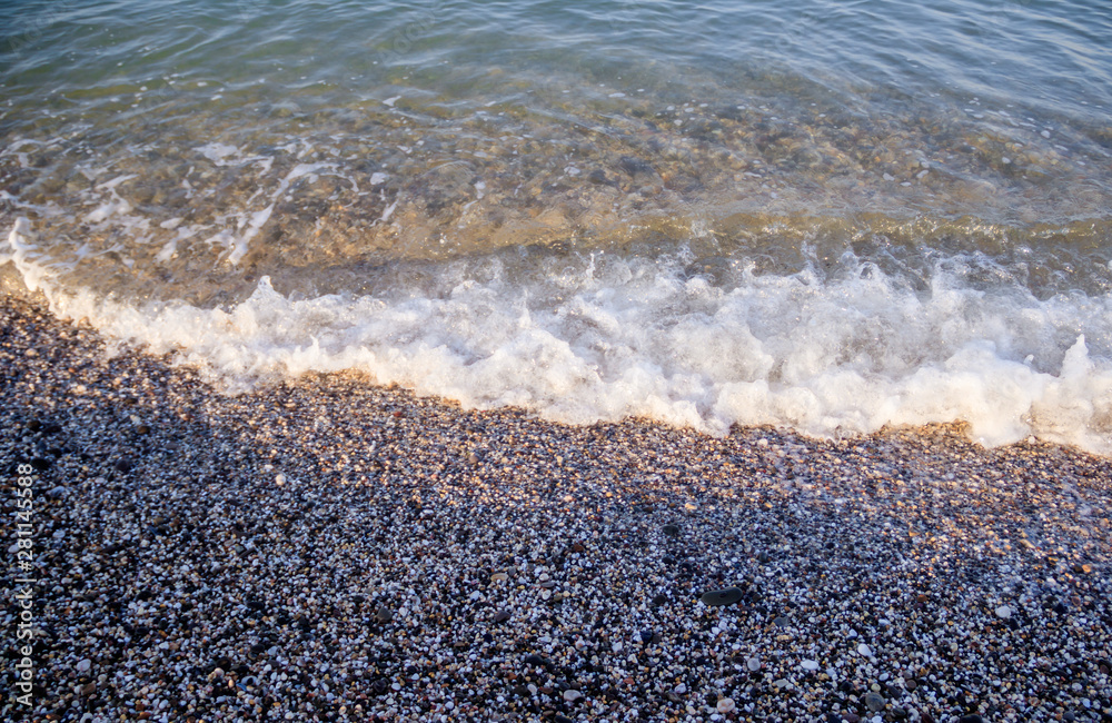 Sea wave in the morning light. Sea wave and beach. Sea wave background. Crimea. Wave and pebble beach. Rest and travel to the sea. Sea wave in the morning light. Sea wave and beach. Sea wave background. Crimea. Wave and pebble beach. Rest and travel to the sea.