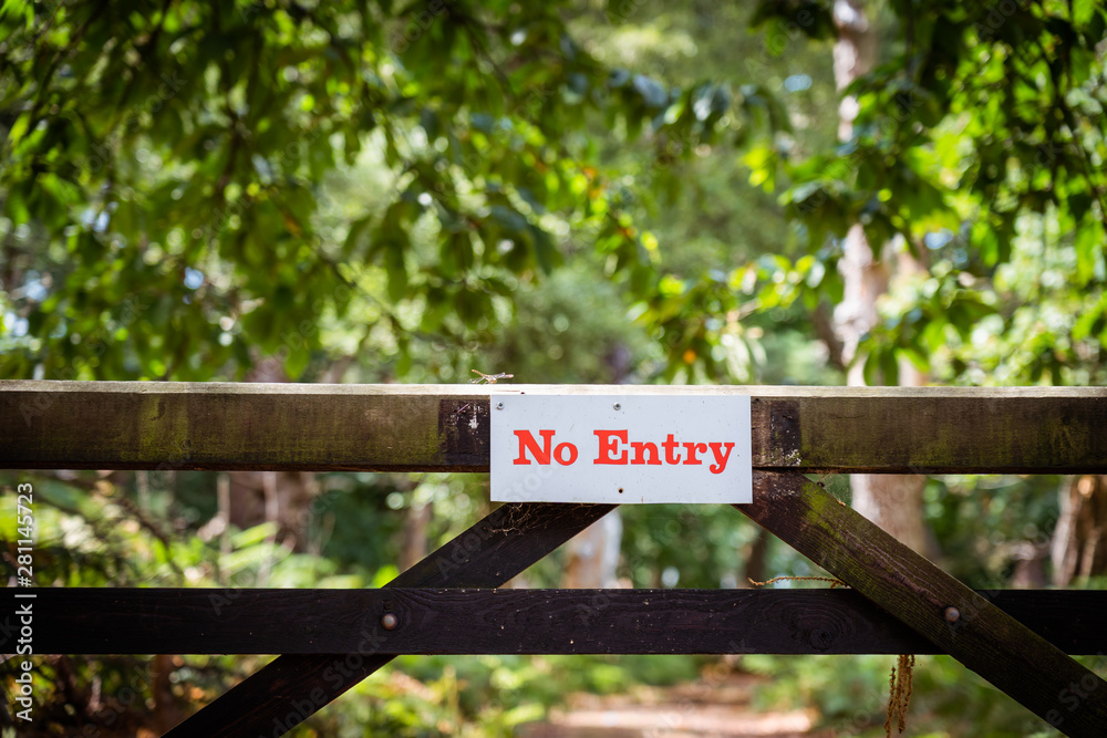 No entry board sign on a fence in the forest. Nature reserve territory. Protection of private property. Copy space. No entry board sign on a fence in the forest. Nature reserve territory. Protection of private property. Copy space.