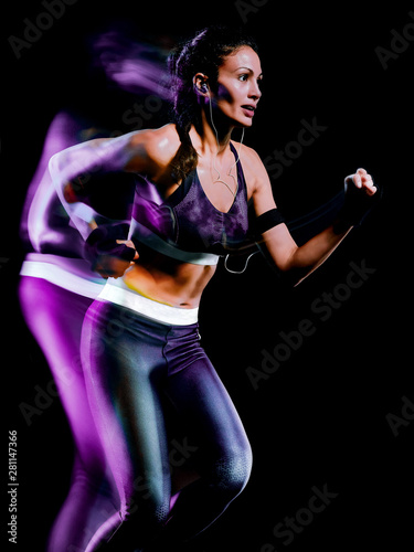 one beautiful caucasian mixed race woman unner jogger jogging running in studio isolated on black background © snaptitude