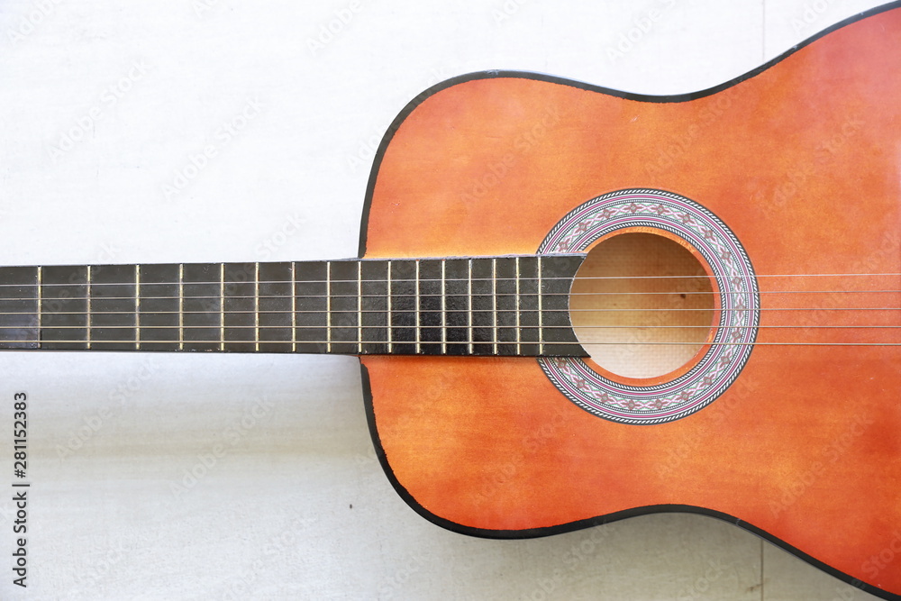 close up half acoustic guitar on white background with right free space