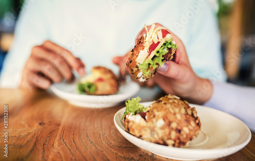 Couple having breakfast in a cafe, close up photo. Love, dating, food, lifestyle concept