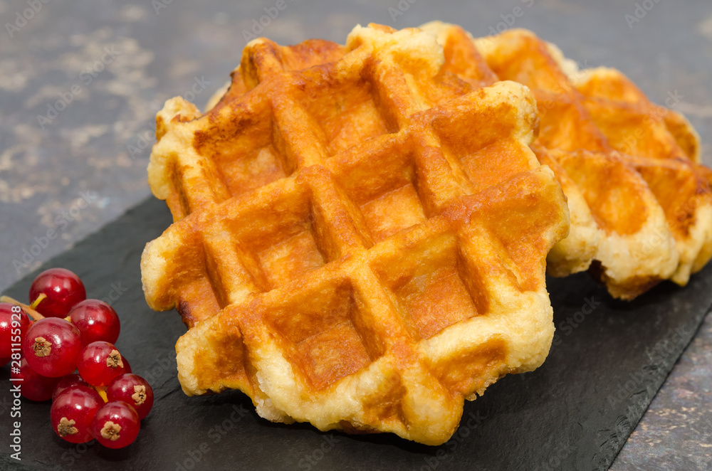 Delicious Belgium waffles on a rustic background Delicious Belgium waffles on a rustic background