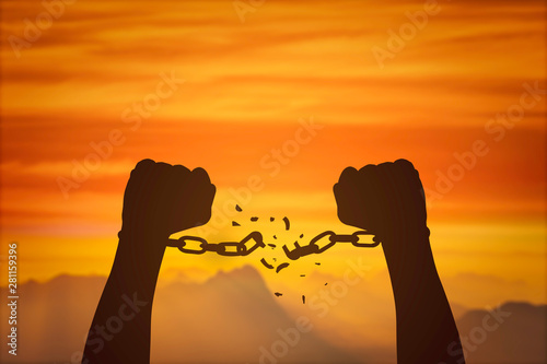 Obraz na plátne silhouette hands and broken chains .Freedom concept